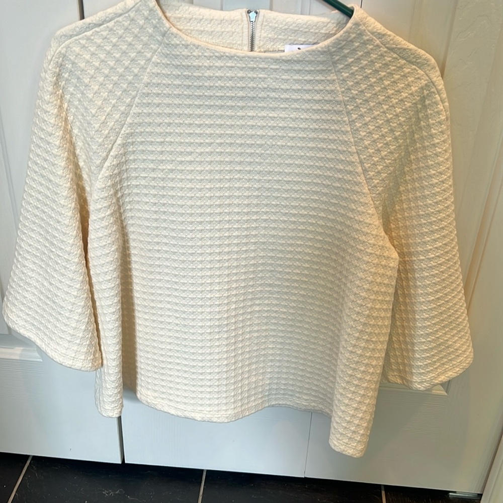 Anthropologie, cream colored, hip length, bell sleeve shirt